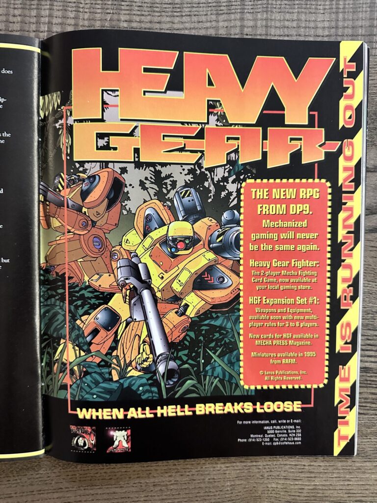 Print ad for the Heavy Gear game line in White Wolf Inphobia roleplaying game magazine, issue 52. 1995. It depicts brightly colored giant robots charging in jungle.